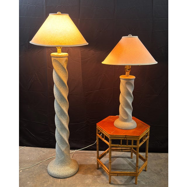 This matched pair of plaster lamps features barley-twist spiral shafts finished in a speckled grey faux granite texture, a...