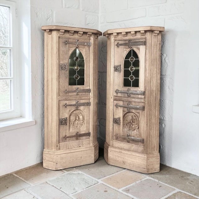 A pair of rustic Gothic Revival corner wine cabinets, hand crafted from solid oak and finished in a warm, natural tone...