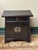 Design Plus Gallery presents a Lacquered Nightstand with Chinese Influence. The bedside table is black with a bit of red...
