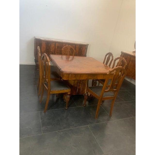 High-quality cabinetmaker’s dining room set, consisting of 2 sideboards, a mirror, a table, and 6 chairs. the sideboards...