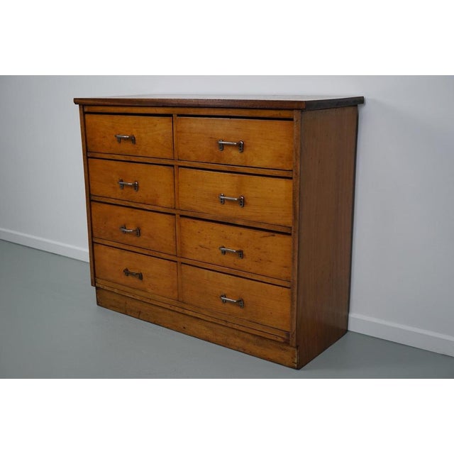 This apothecary cabinet was made circa 1950s in the Netherlands. The cabinet was used on a school to store painting...