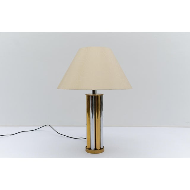 You are bidding on one of a total of three. See joint photo of all three lamp bases together. the photo with the lampshade...