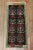 A late 20th century mini size turkish rug with a tribal motif. This piece is a true vintage, one of a kind rug that has...