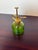 This vintage mister, spray bottle made of green glass that stands 6 inches tall and has a brass handle which spritzes...