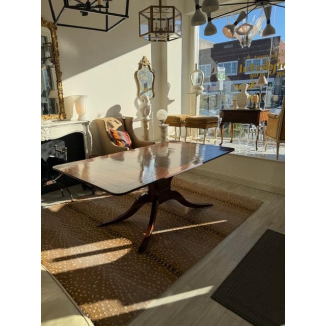 This is a Rose Tarlow Pickwick dining table with a 4" banded edge, rectangular and radiused corners, straight grain. This...