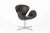 This brown mid century Danish modern Swan chair by Arne Jacobsen for Fritz Hansen was made in Denmark and produced in...