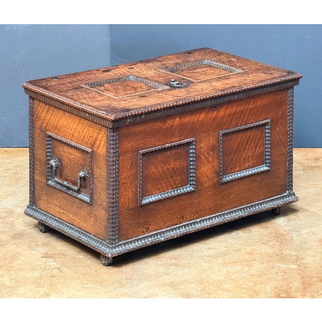 A handsome Continental rectangular iron-bound bullion (or strong) box or coffer chest of patinated walnut from the...