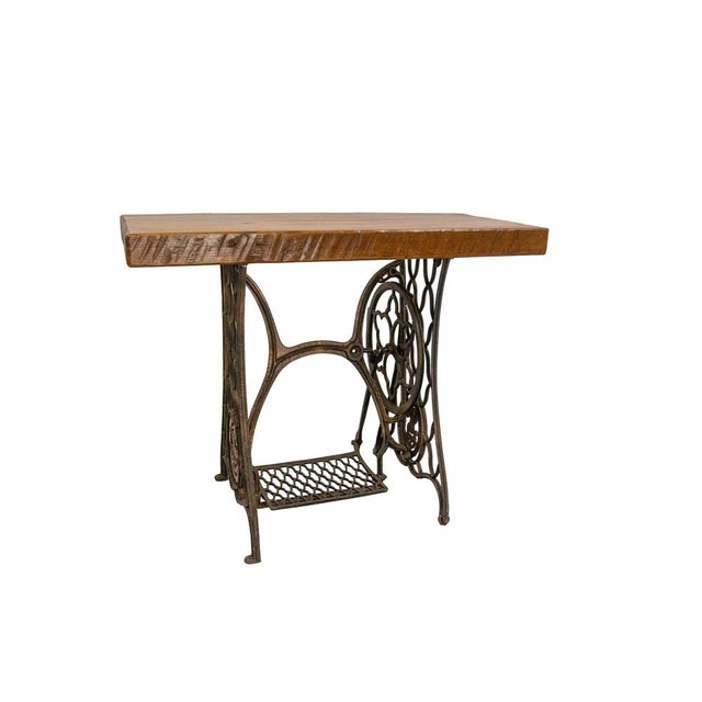 French console or side table made circa 1960. This table was assembled circa 1960 from a wrought iron base of sewing...