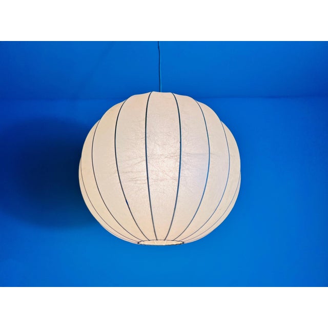 This is a cocoon hanging lamp crafted in Italy during the 1960s, showcasing the elegance and innovation of mid-century...