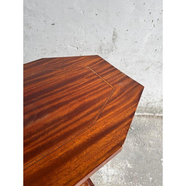 This Interbellum side table from 1930 is a beautiful example of Belgian craftsmanship. The table top shows a prominent...