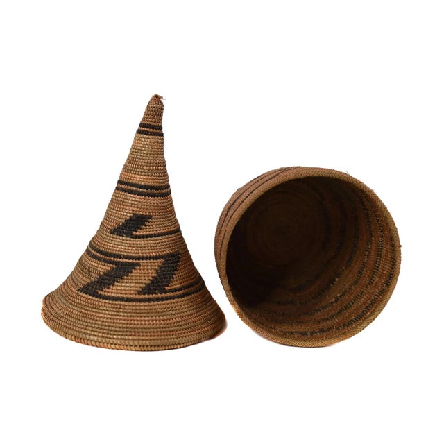 The Tutsi Tight Weave Basket with Lid from Rwanda epitomizes the artistry and tradition of the Tutsi community's weaving...