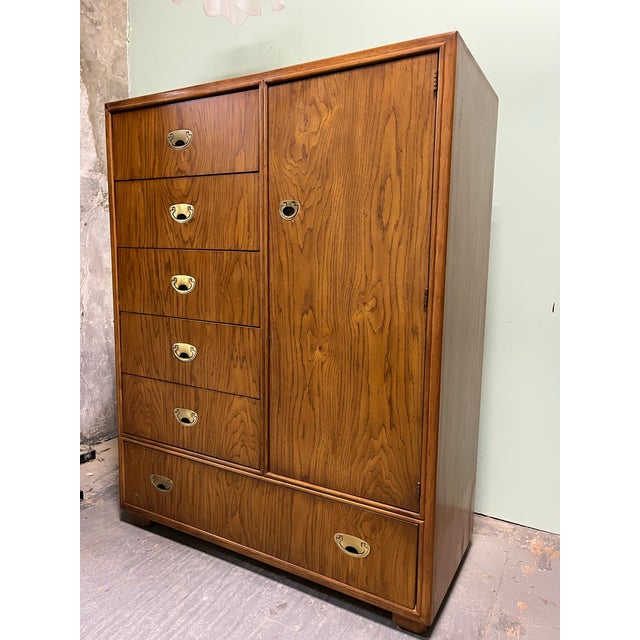A gorgeous mid-century modern Hollywood Regency Campaign style armoire dresser or gentleman's chest By Drexel Heritage...