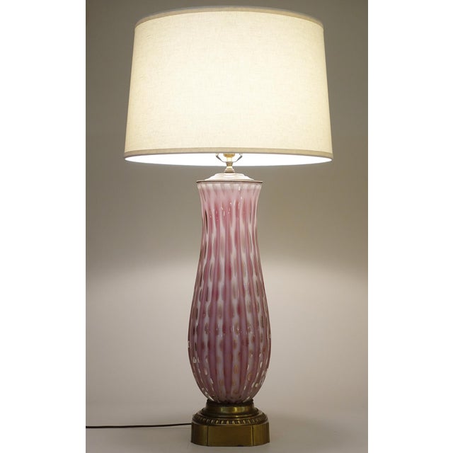 A dramatic and massively huge hand blown "Costolato" ribbed & controlled bubble Pink Art Glass and Brass sensuous form...