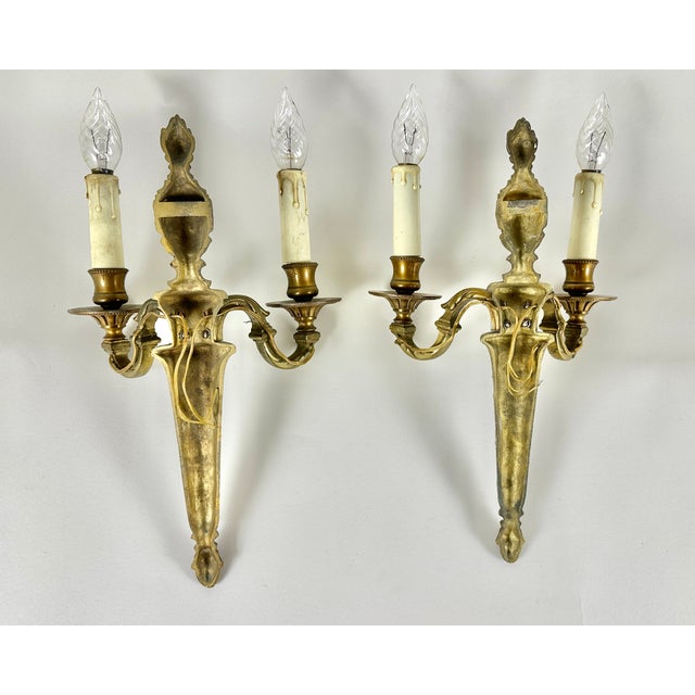 Elevate your home décor with this elegant pair of French brass sconces, dating back to the 1950s. Originating in France,...