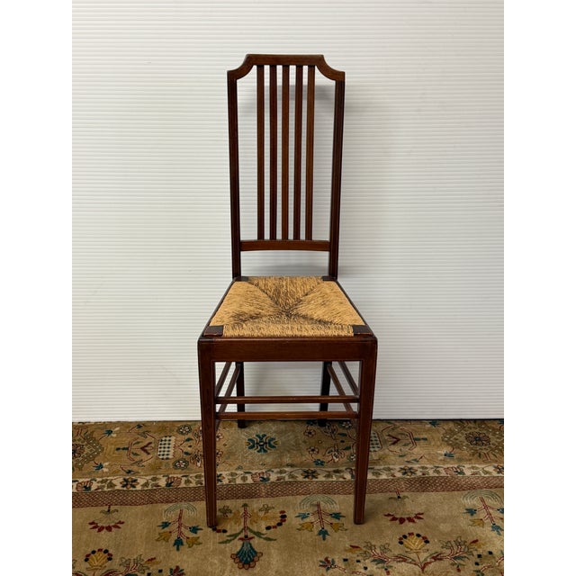 Design Plus Gallery presents an Antique Federal Revival Inlaid Wood Rush Seat Side Chair. The wood frame displays fine...
