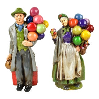 Vintage Old Man and Woman Balloon and Flower Sellers Figurines - 2 Pieces For Sale