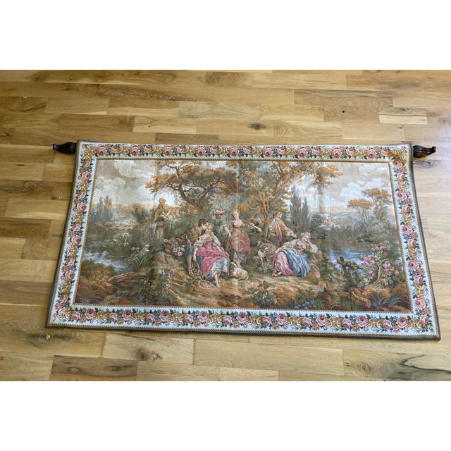 A beautiful Gobelins tapestry made in France, showcasing a pastoral scene with elegantly dressed figures in a lush...