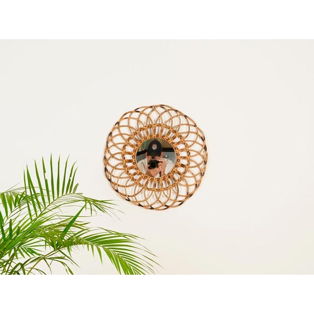 Stunning and unique Mid-Century French Riviera style round mirror, fully handmade in rattan and wicker. This stylish...