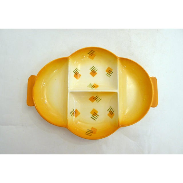 Modernist Art Deco appetizer dish, Bauhaus style, rounded cloud shape with 4 compartments and 2 small side handles;...