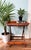 Charming vintage bamboo tray table featuring a raised rim, woven bamboo surface, and warm honey-toned finish. Designed to...