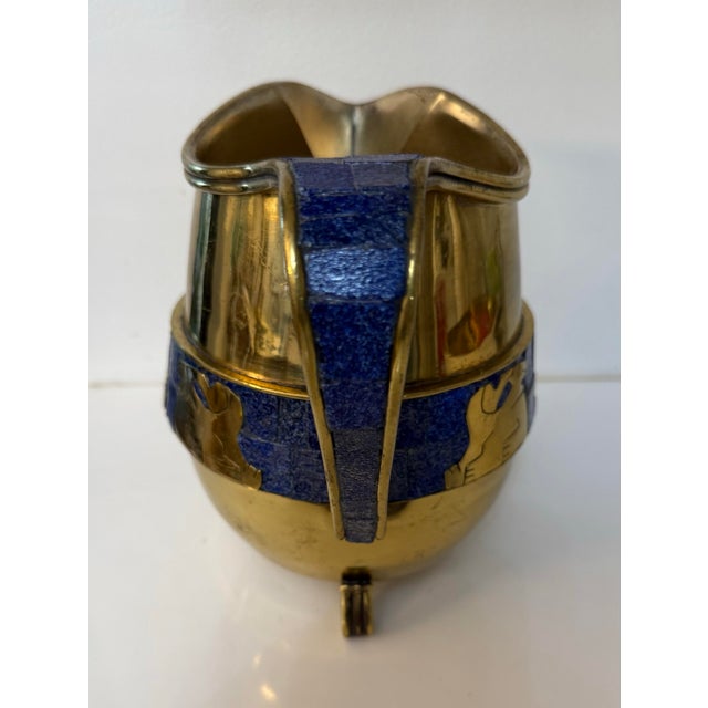 A marked Hecho Mexico, no 433 attributed to Salvador Teran. It is lovely shiny brass with a band of lapis lazuli mosaic...