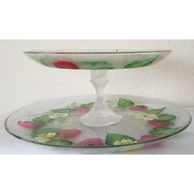 We love this extraordinary and precious Mid-Century Modern frosted glass 2 tiered serving platter for it's lovely hand...