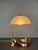 This gorgeous little table or desk lamp was purchased in a French artisan's shop in the late 80s. If it was made then or...