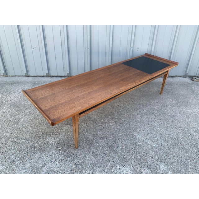 Merton L. Gershun for Dillingham "Esprit" Coffee Table. Features a walnut body with ebony accents.