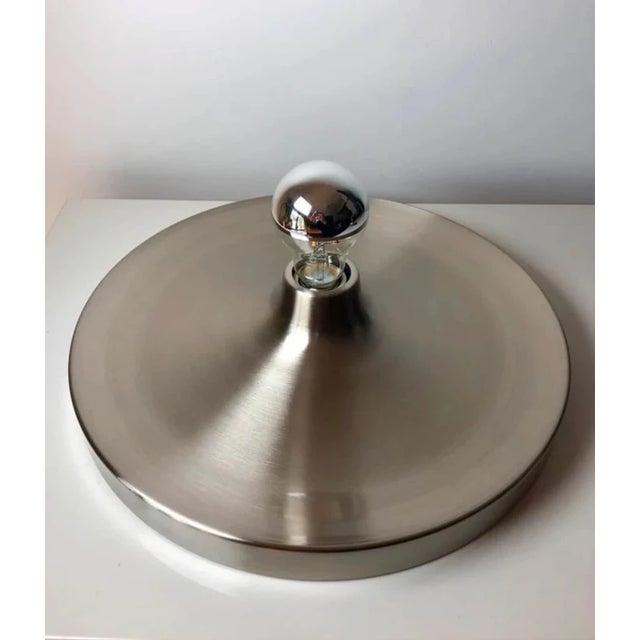 An elegant modernist wall/ceiling light inspired by the design of charlotte perriand, famous for her decorative selections...