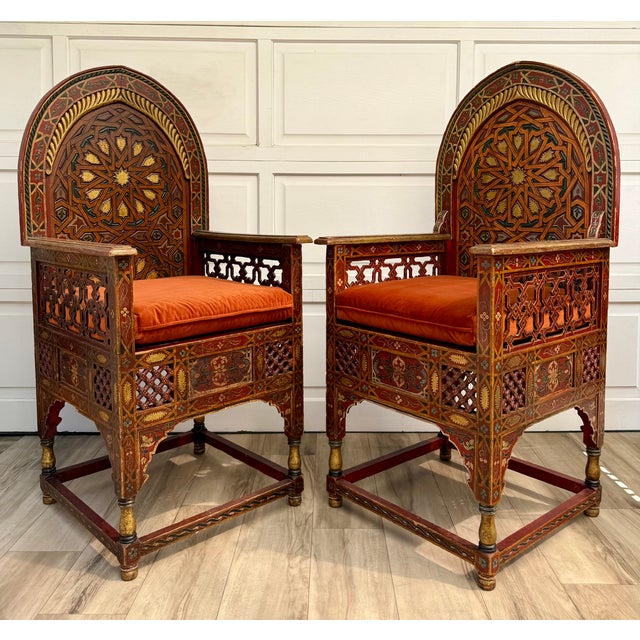 Here is a spectacular pair of vintage Moroccan throne chairs, likely dating to the later mid-20th century. Crafted of...