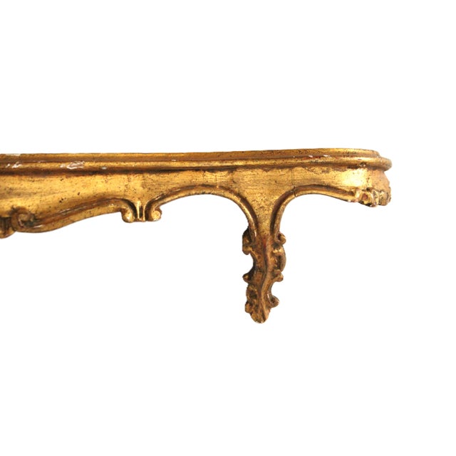 Made in Italy hand-carved antique giltwood wall shelf.
