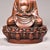 This finely crafted copper statue depicts Shakyamuni Buddha seated in meditation pose upon a detailed lotus pedestal....
