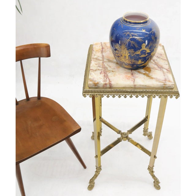 Solid machined brass stand end side table with onyx top.