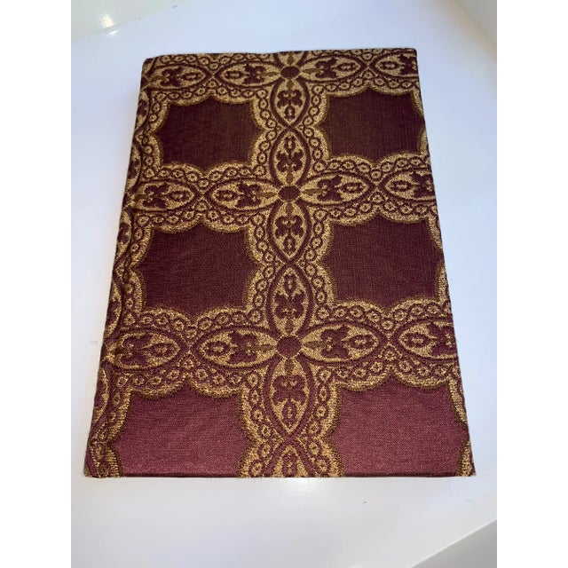 This is a fabric covered journal filled with blank, no-lined paper. The antique fabric wrapped around the journal is...