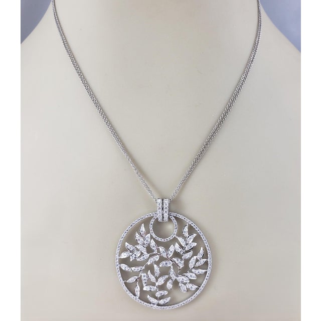 18K White Gold and Diamond Floral Circle Pendant Necklace- This stunning 18K white gold circle pendant features 254 round...