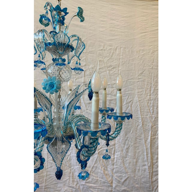 Beautiful chandelier with 8 lights probably processing of the company avem brass and iron structure, original 1950s...