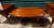 This elegant furniture grouping consists of one oval coffee table and two matching end tables, characterized by their...