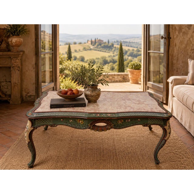 Decorative vintage low table or coffee table with a shaped rouge marble top, serpentine apron, cabriole legs, and hand-...