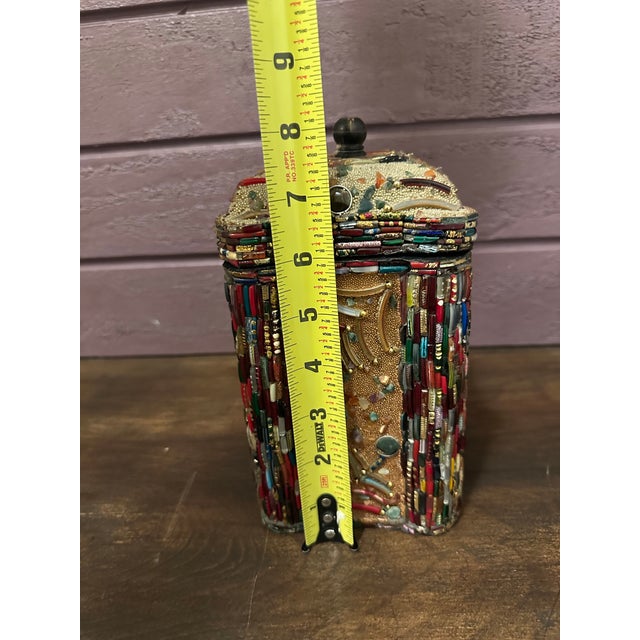 Exquisitely detailed, multi-colored, beaded box with a black velvet lining and bottom. Intricate care was put into...