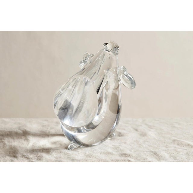 An elegant, clear Murano glass elephant, an authentic piece from the 1950s that epitomizes Venetian craftsmanship. Signed...