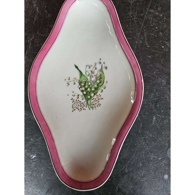 Pretty small condiment dish probably used for sauce, olives etc. Made in France For Kerr in Philadelphia who were known...