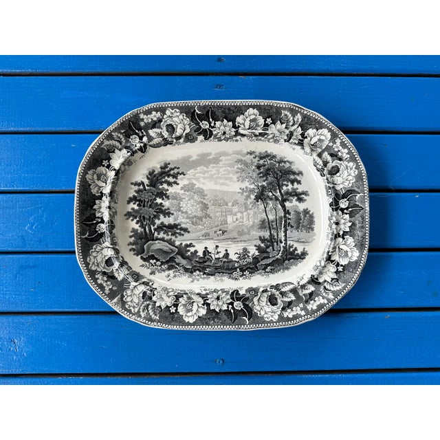 Earthenware Transferware Platter by Enoch Wood of Staffordshire, marked on the back as "91 Wood." The black transferware...