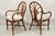 Vintage Hollywood Regency Bentwood Rattan Fan Back Dining Chairs - Set of 4. Circa Late 20th Century. Measurements: 36" H...