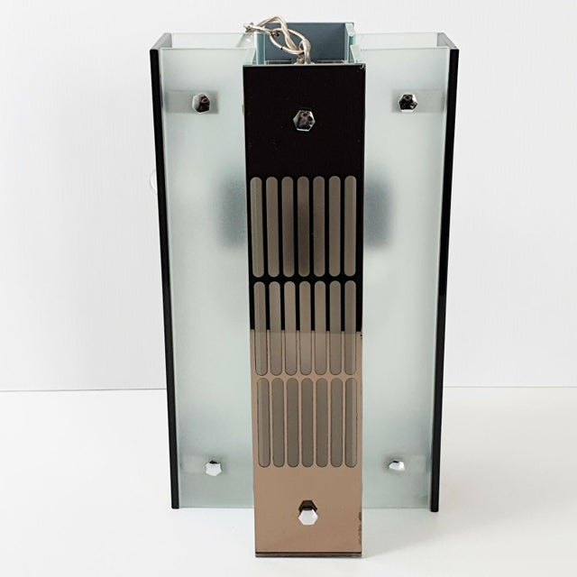 Good overall condition, but with some chips, particularly on several upper corners, and a small internal crack. Total...