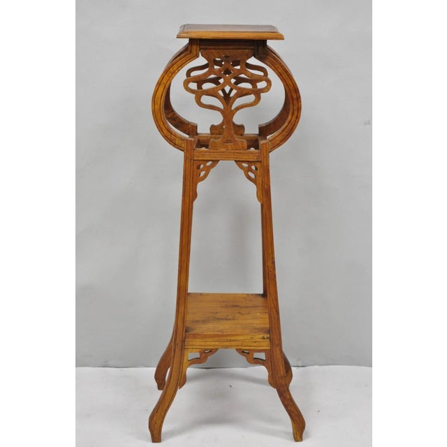 Vintage French Art Nouveau Style Carved Teak Wood Pedestal Plant Stand Side Table. Circa Late 20th Century. Measurements:...
