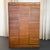 This industrial tambour-front birch document file cabinet is a striking example of early to mid 20th century office...