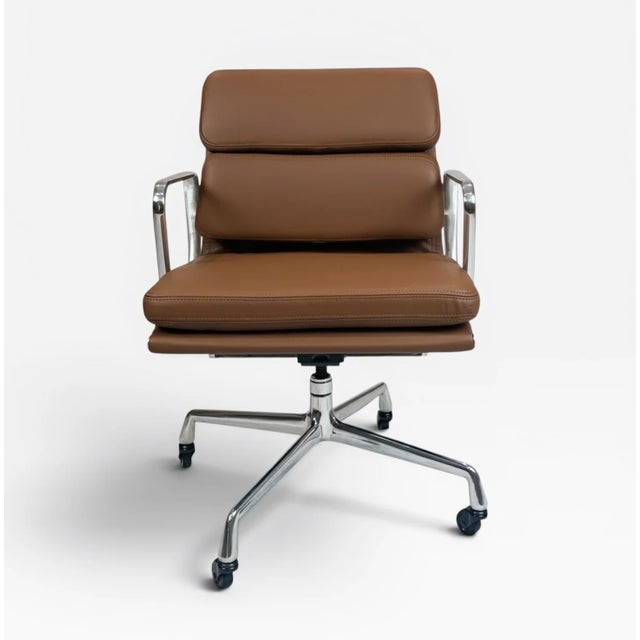 A refined Eames Aluminum Group Soft Pad Management Chair, originally designed by Charles & Ray Eames. This example is...