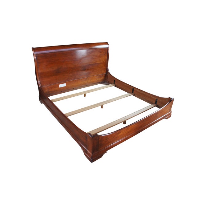 Stickley French Louis Philippe Style Queen Size Sleigh Bed, #7811, circa 2005. Made from solid cherry with a shapely form...