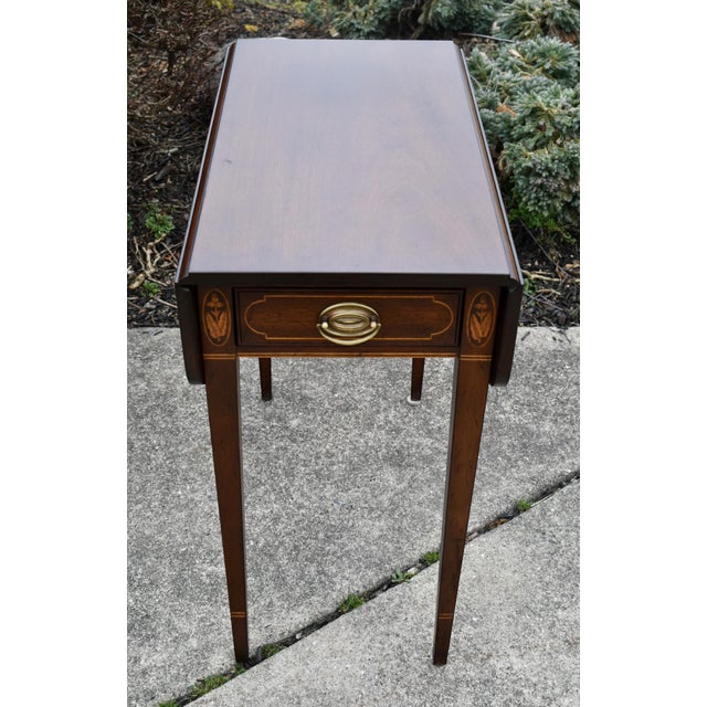 Vintage (1970's) Pembroke Table has a Federal Style. Made by Kittinger Furniture. The Wood is Mahogany. Inlaid Mahogany....
