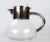 A crystal carafe with silverplate handle and spout. Light Tarnished.